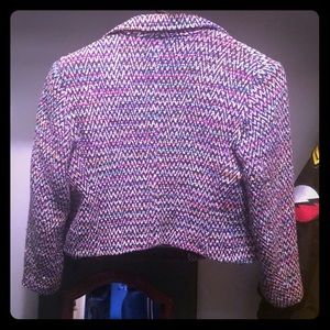 Worn but cared-for handwoven silk blazer